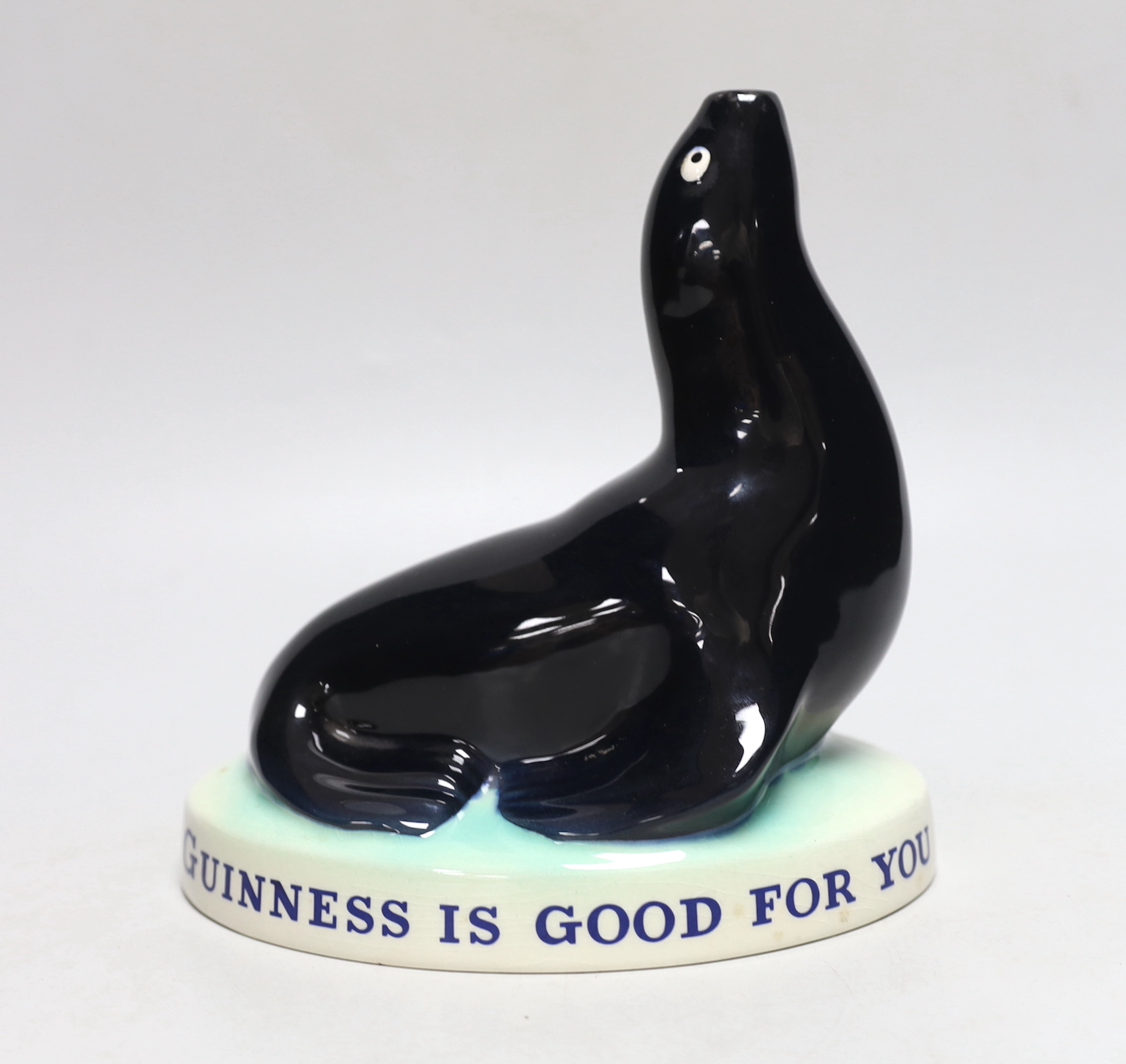 A Carltonware Guinness ‘seal’ lamp stem “Guinness is good for you”, 18cm tall